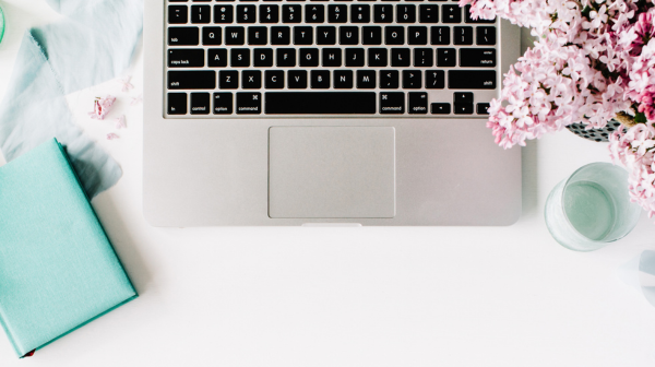 Laptop with flowers and planner
